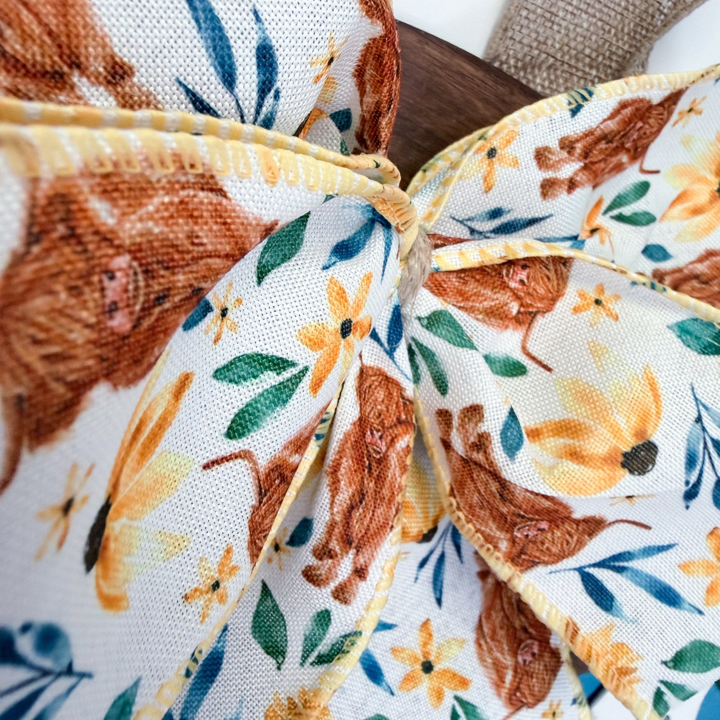 Close-up of fabric with cow and floral pattern