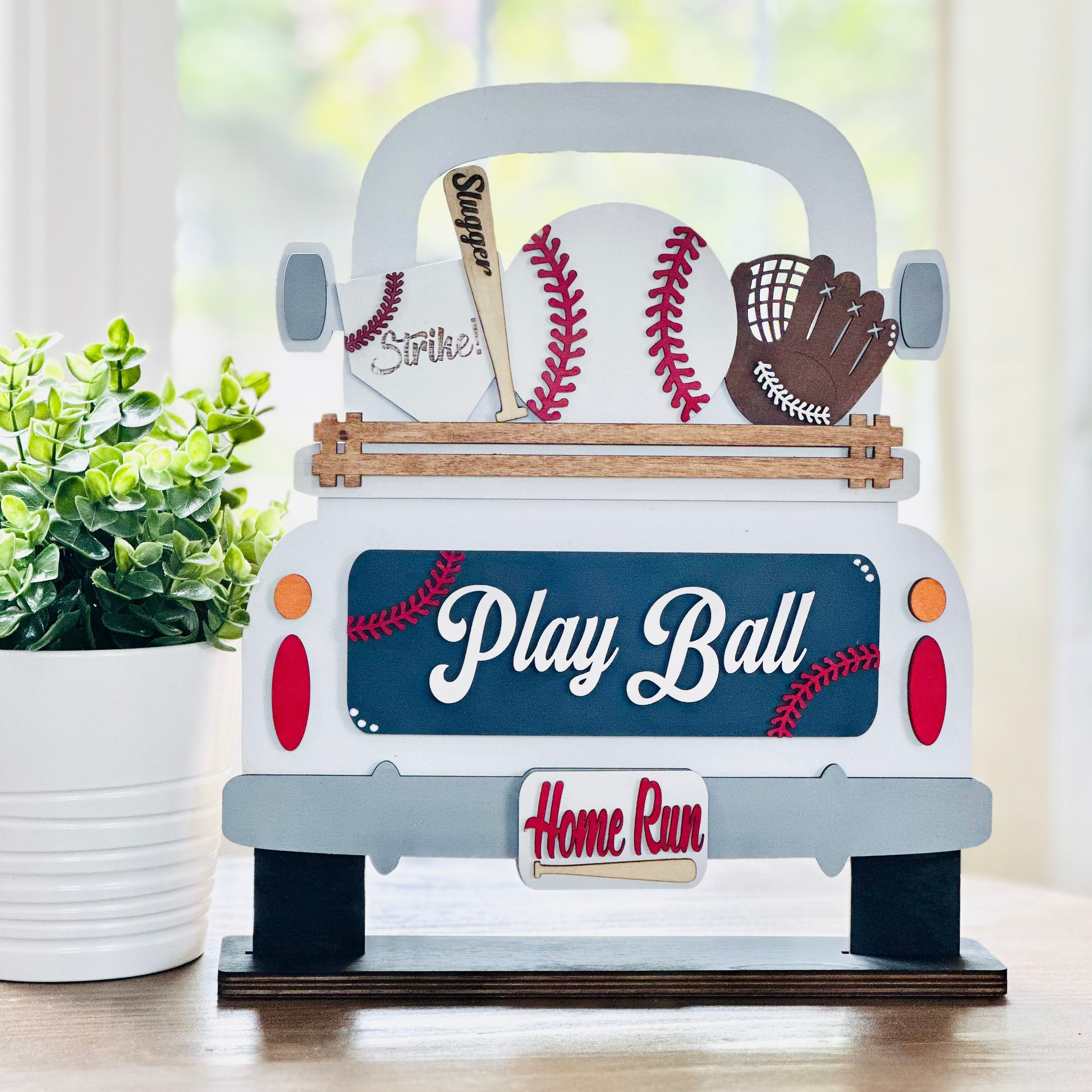 White truck with baseball themed layered pieces