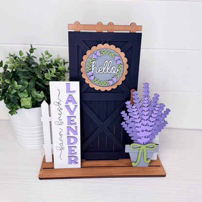 Decorative sign with 'hello' and lavender design, accompanied by a potted plant and lavender flowers on a white background.