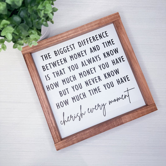 Framed quote on a white background with a plant to the left