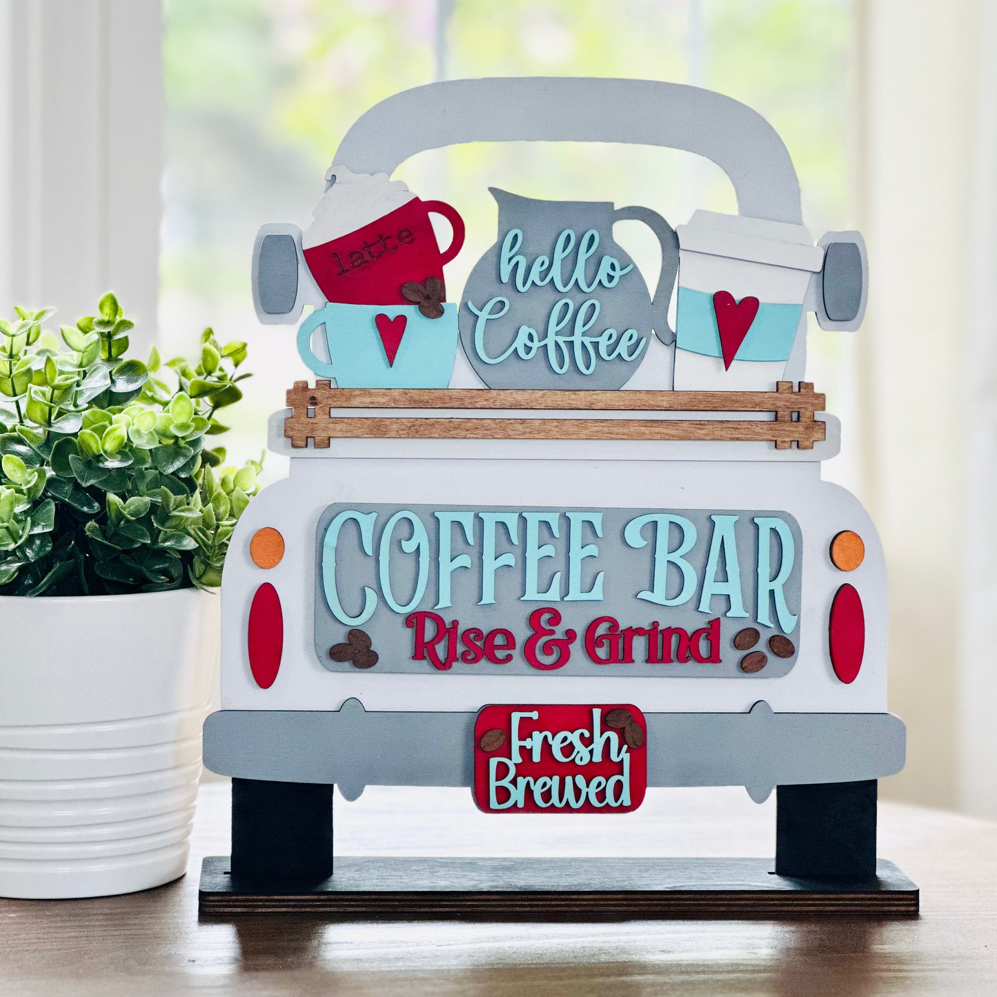 A decorative wooden coffee bar interchangeable insert featuring a vintage truck design with coffee cups and text decorations.
