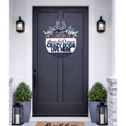 Decorative door decal with text and flowers on a dark gray door.