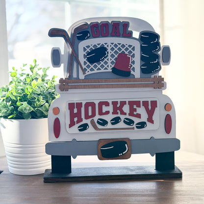 Hockey-themed decorative item on a table with a plant in the background