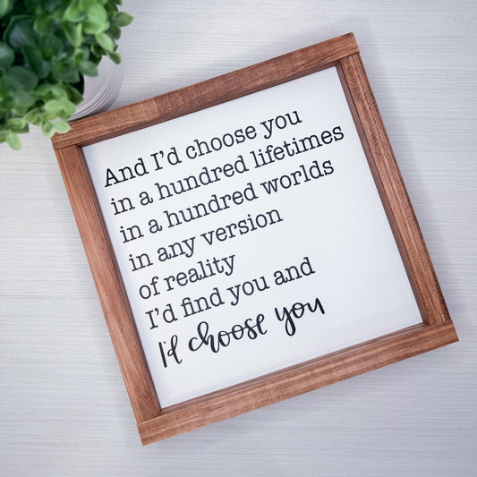 Framed quote on a white background with a wooden frame