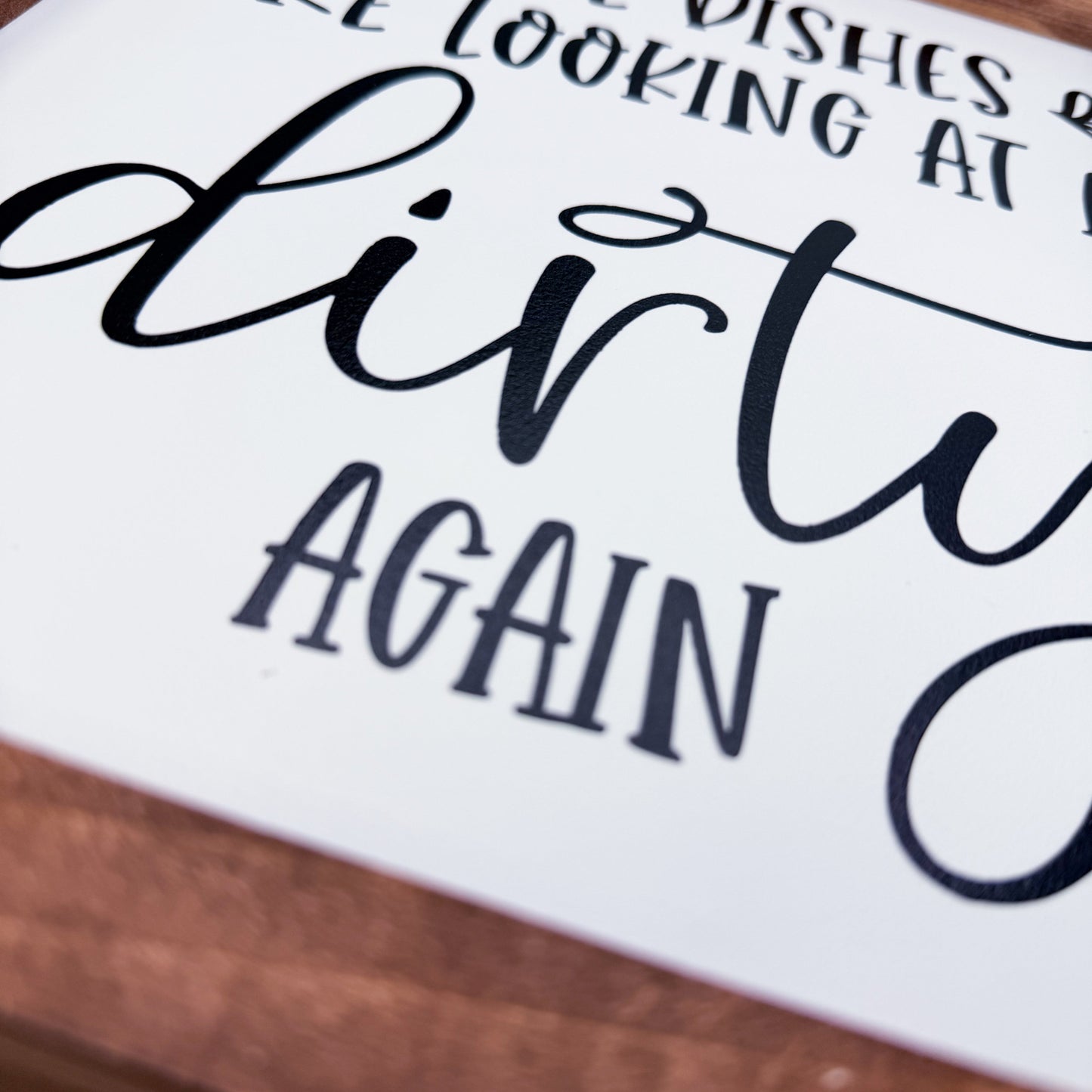 Text on a white background with black ink, partially visible text 'looking at', 'dishes', 'dirty', 'again'.