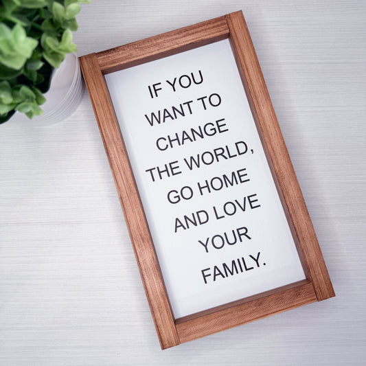 Wooden frame with motivational quote on a light background