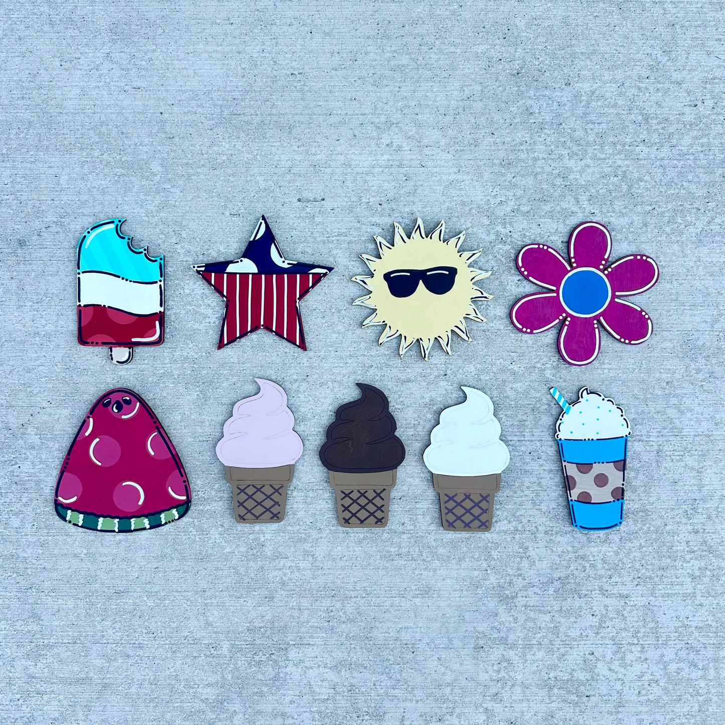 Set of colorful summer-themed pieces on a textured gray background