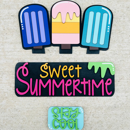 A decorative wood truck with interchangeable insert displaying the text 'Sweet Summertime' and various summertime-themed items.