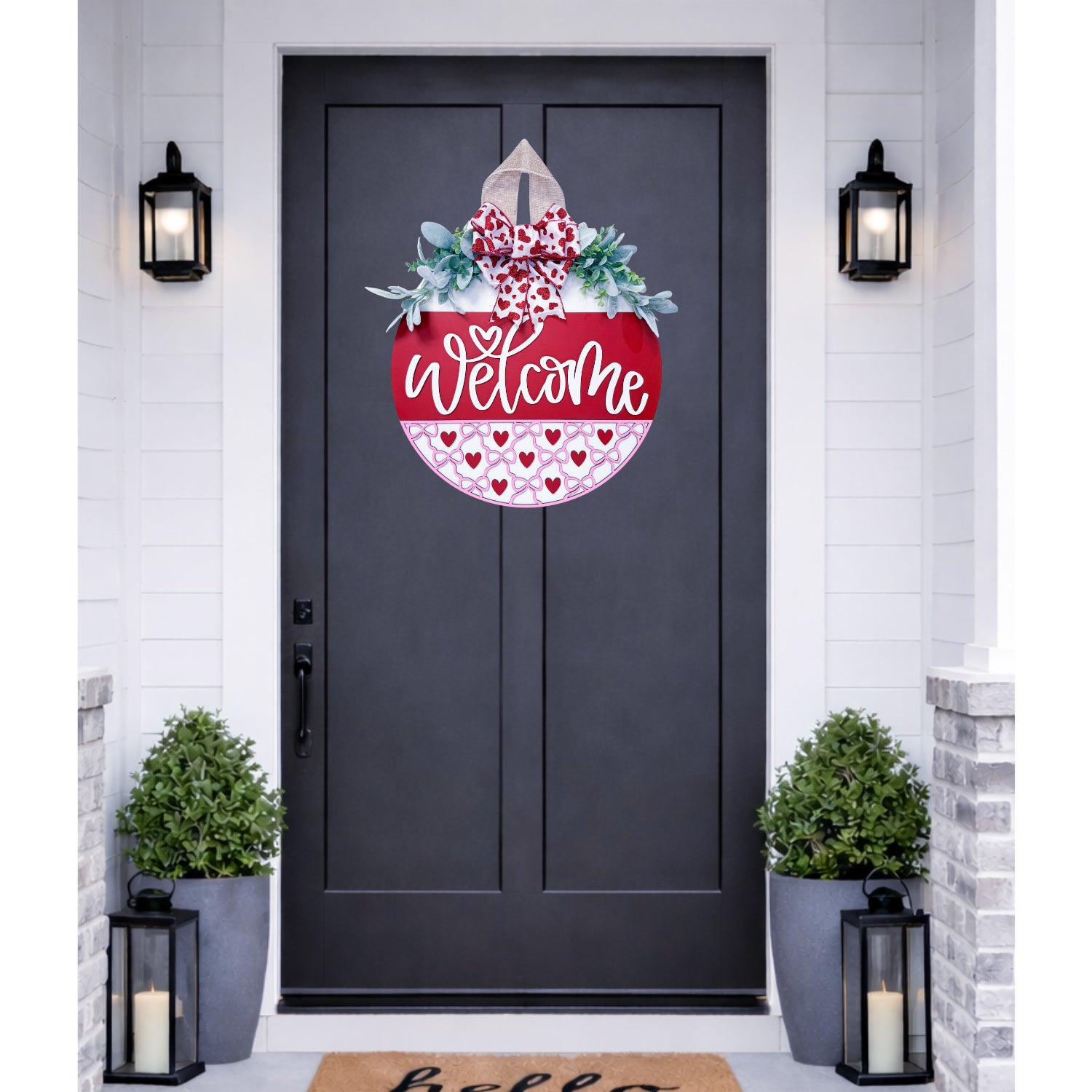 Decorative door hanger with 'Welcome' text on a black door.
