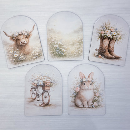 Set of five decorative arch's featuring animals and floral designs on a white background