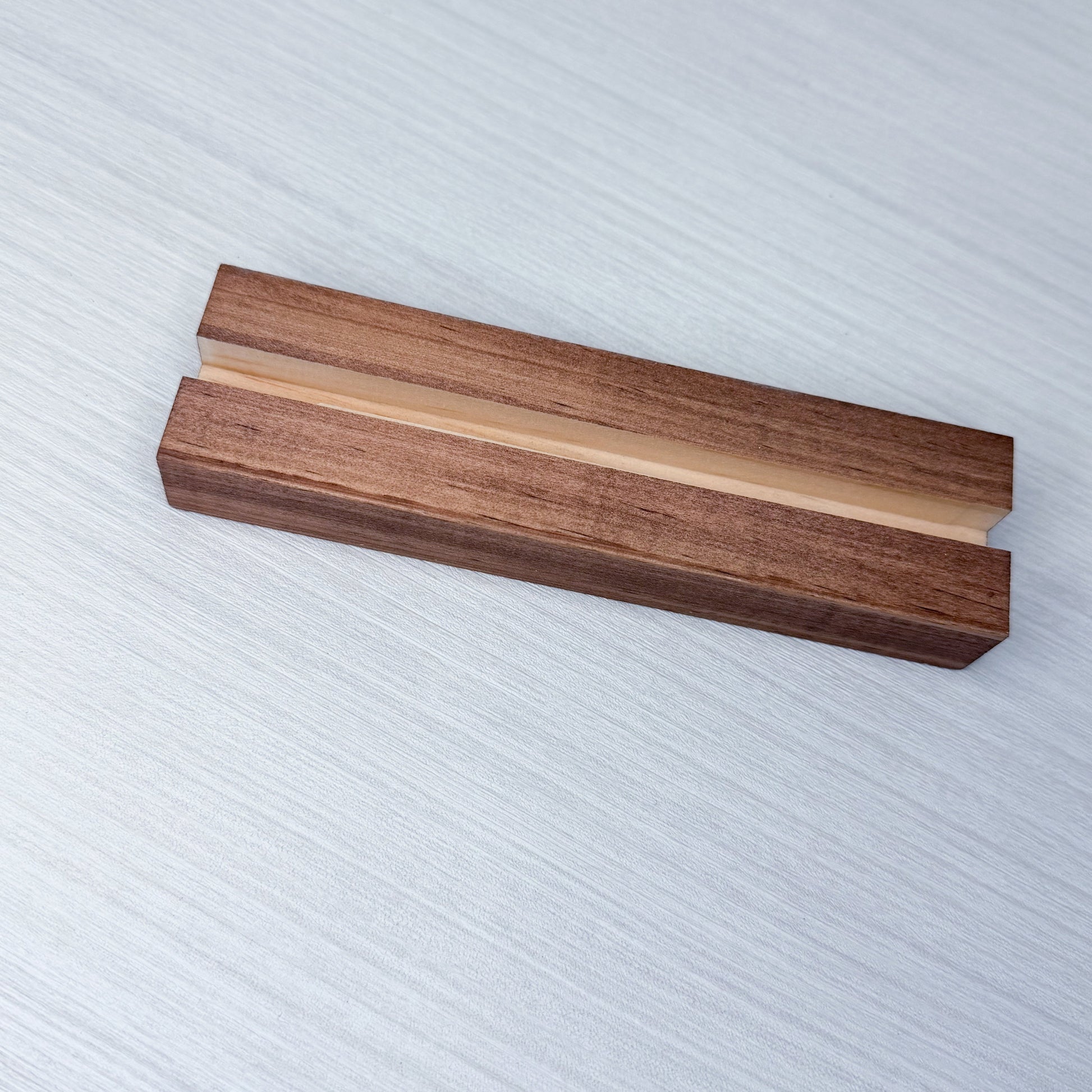 Wooden drawer stand on a textured white background