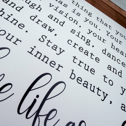 Close-up of a motivational quote on a white background