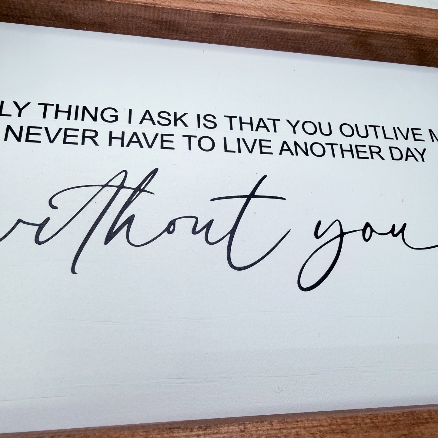 Wooden frame with a romantic quote on a white background