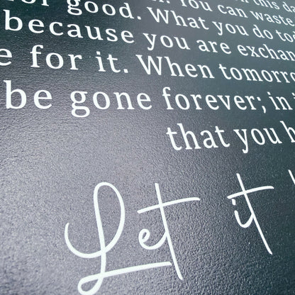 Text on a textured surface with 'Let it' in cursive