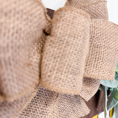 Close-up of a decorative wreath with burlap texture