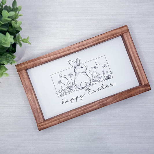 Framed artwork with an Easter bunny illustration and 'Happy Easter' text on a white background.