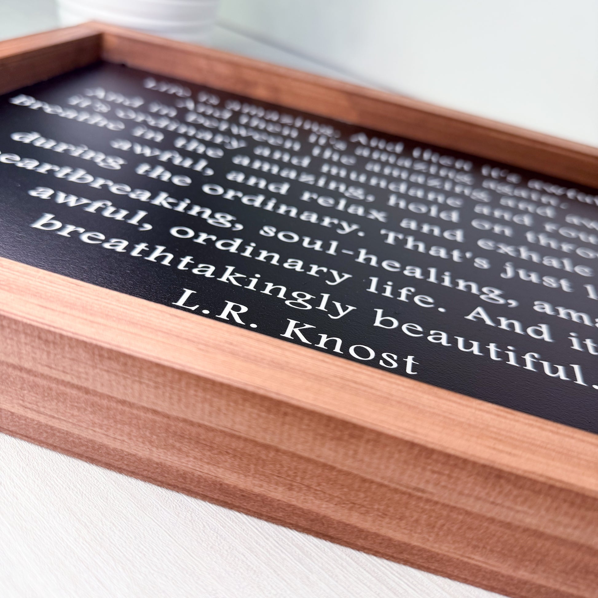 Wooden sign with text on a white surface