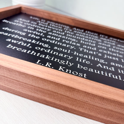 Wooden sign with text on a white surface