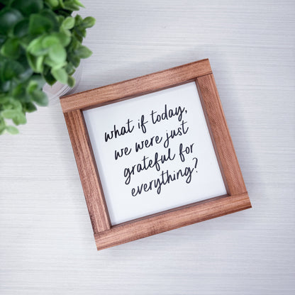 Wooden frame with motivational quote on a light background