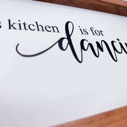 Decorative sign with text 'kitchen is for dancing' on a white background