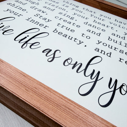 Wooden frame with motivational quote on a white background