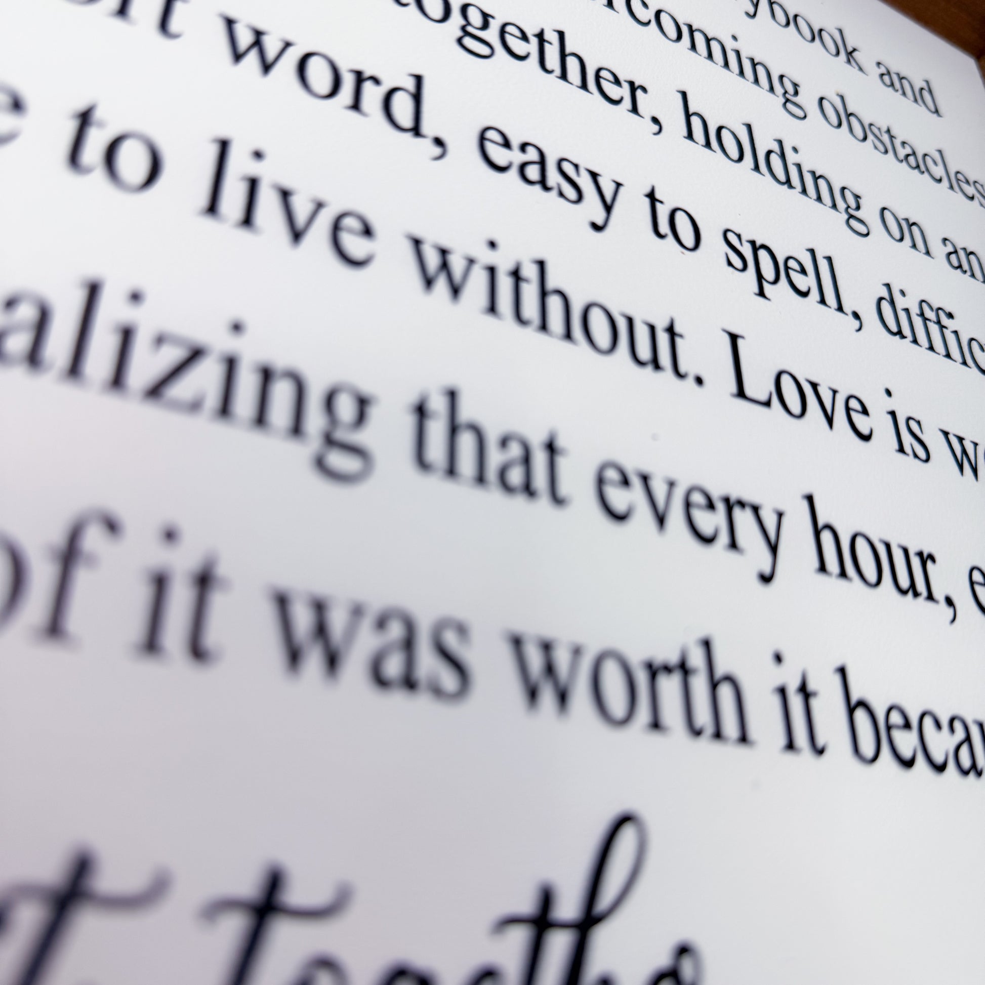 Close-up of text on a wood sign