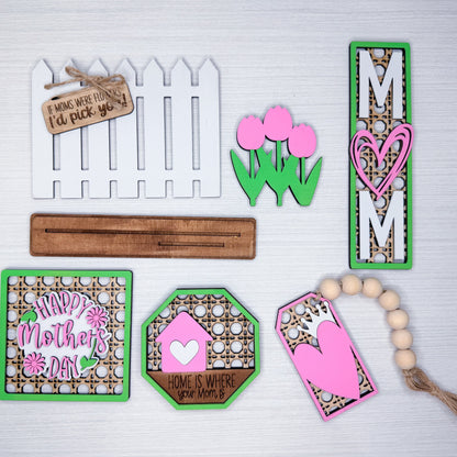 Collection of decorative wooden signs with Mother's Day-themed designs on a white background.