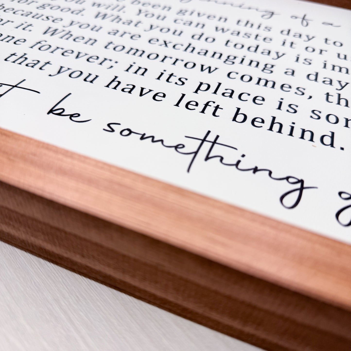 Wooden block with text on a white surface