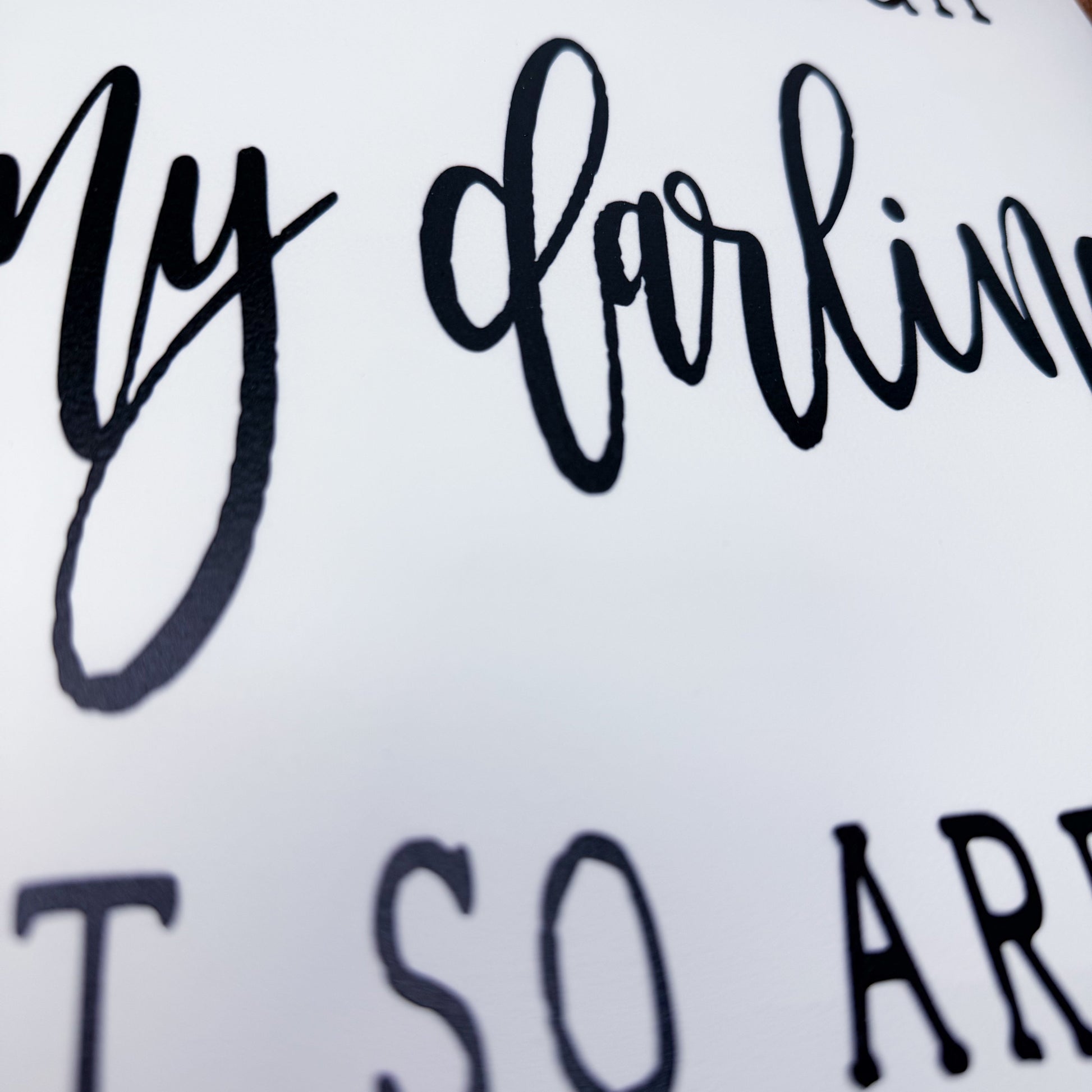 Textured surface with 'My darling' and 'so are' text in black.
