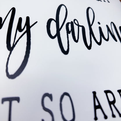 Textured surface with 'My darling' and 'so are' text in black.