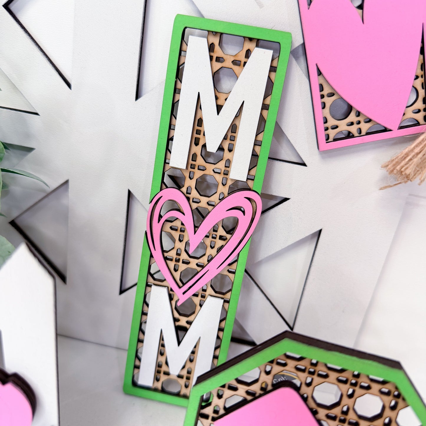 Decorative mom with a heart and leopard print design on a white background