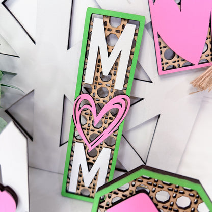 Decorative mom with a heart and leopard print design on a white background