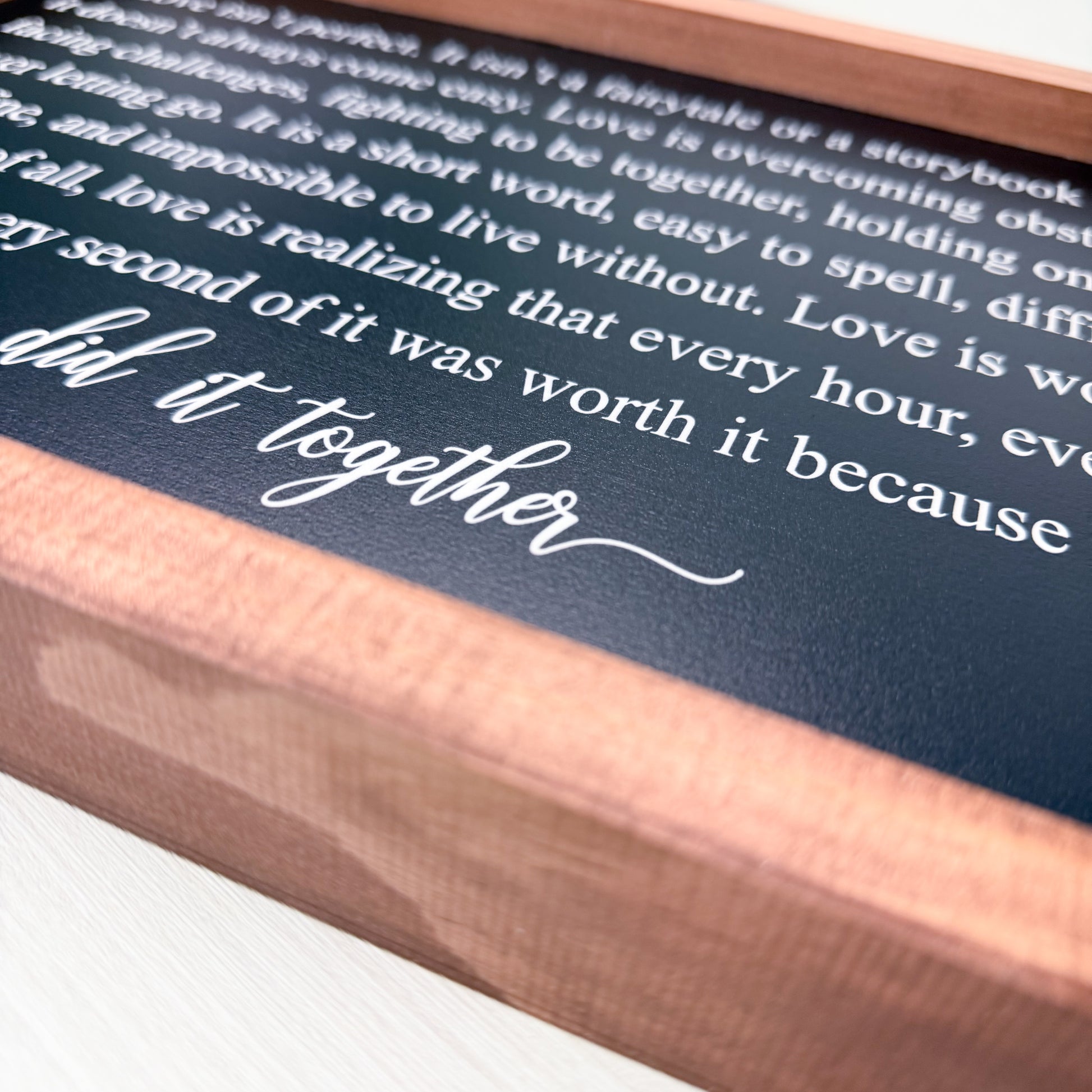 Wooden box with printed text on a black background