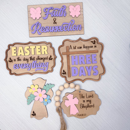 Set of wooden signs with Easter and religious-themed sayings on a white background