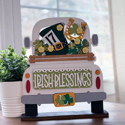 Decorative sign shaped like a truck with 'Irish Blessings' text and St. Patrick's Day elements.