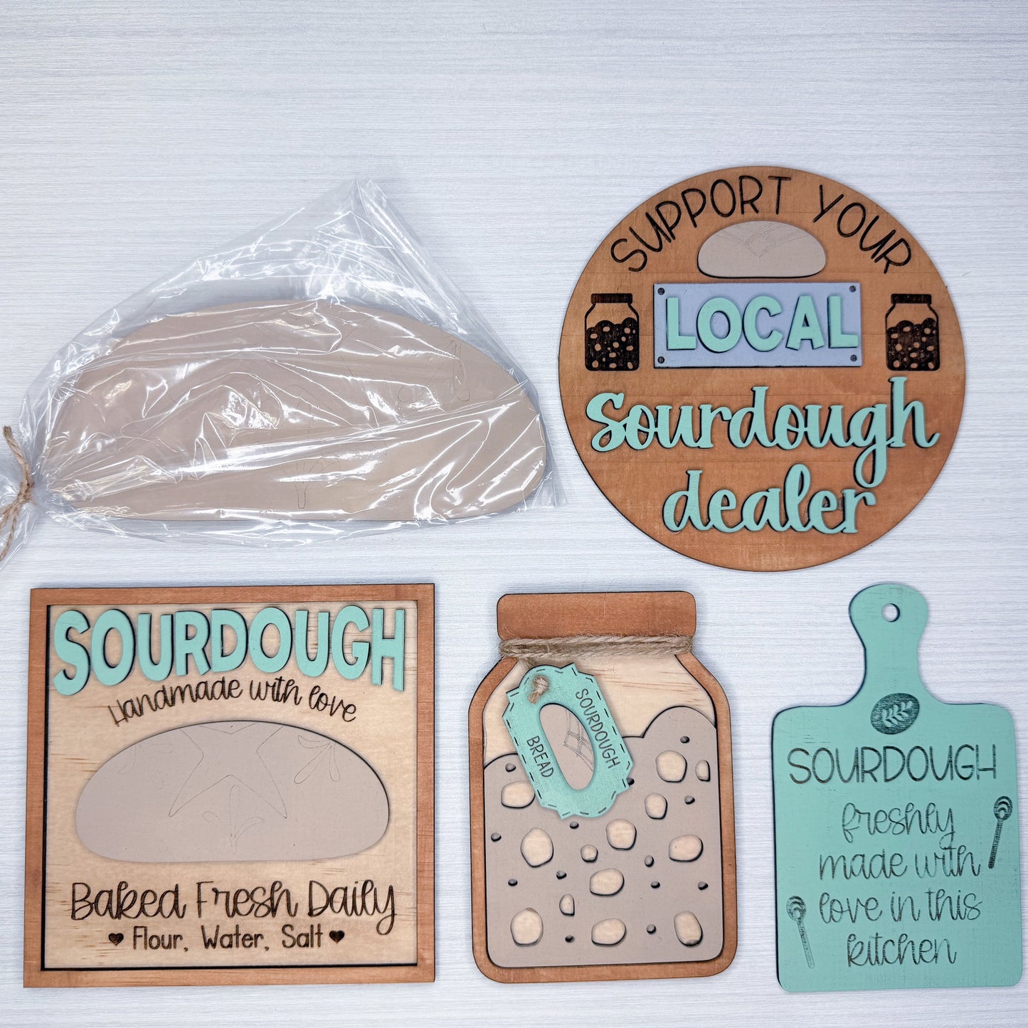 Set of wooden signs related to sourdough baking on a white background