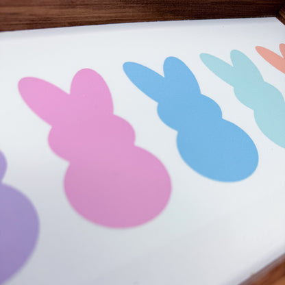 Colorful bunny shapes on a white surface