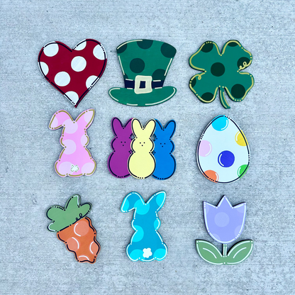 Set of colorful Easter-themed pieces on a textured gray background