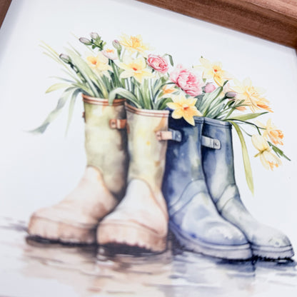 Watercolor illustration of rain boots with flowers in them