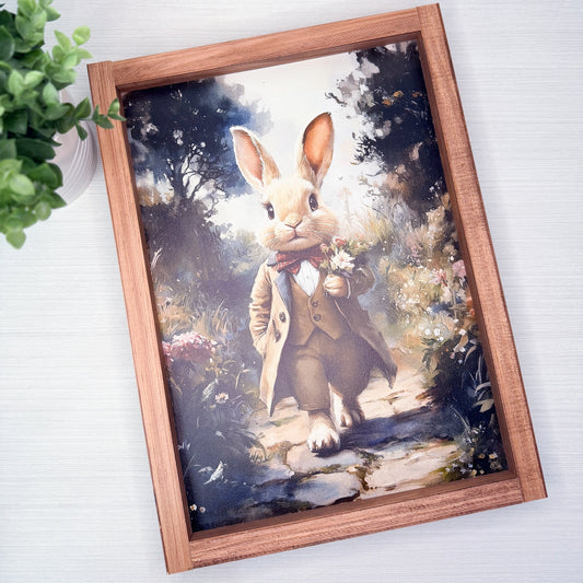 Framed artwork of a rabbit in a suit with a natural background