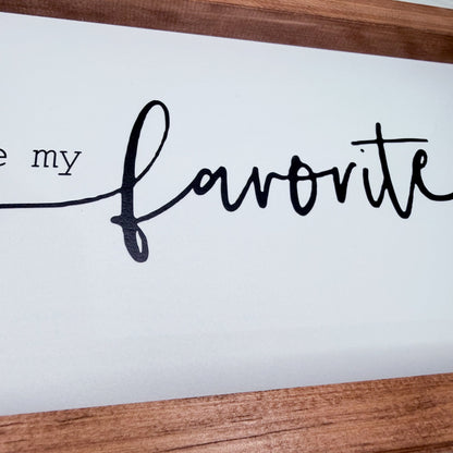 Wooden frame with 'my favorite' text on a white background
