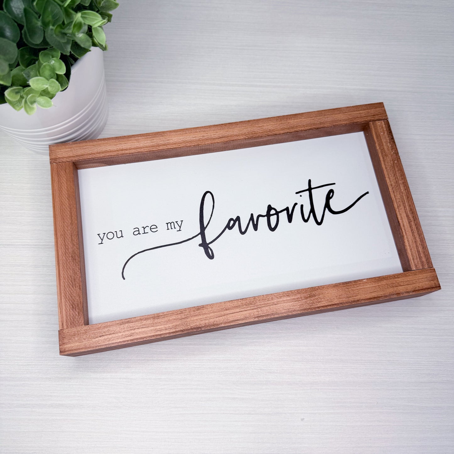 Wooden-framed sign with 'you are my favorite' text on a white background